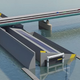Illustration for article titled Ingenious Design Lowers the Water Under a Bridge to Let Tall Ships Pass